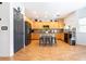 Open kitchen with wooden cabinets, stainless steel appliances, island and hardwood floors at 11134 Casala Ct, Las Vegas, NV 89141