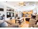 Bright open concept living room with a fireplace, open to the kitchen and dining areas at 11134 Casala Ct, Las Vegas, NV 89141