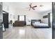Large bedroom with a ceiling fan, neutral colors, and an adjacent sitting area at 11134 Casala Ct, Las Vegas, NV 89141
