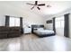 Large main bedroom suite with ceiling fan, a couch, and light gray wood floors at 11134 Casala Ct, Las Vegas, NV 89141