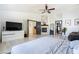 Spacious main bedroom with fireplace, ceiling fan, and gray wood flooring at 11134 Casala Ct, Las Vegas, NV 89141
