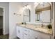 Updated bathroom featuring dual sinks and granite countertops at 11157 Sandy Grove Ave, Las Vegas, NV 89144