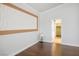 Bedroom featuring an art piece on the wall, wood floors and natural light at 11157 Sandy Grove Ave, Las Vegas, NV 89144