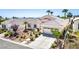 Beautiful home with a well-manicured front yard, desert landscaping, and charming curb appeal at 11157 Sandy Grove Ave, Las Vegas, NV 89144
