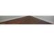 Beautiful, dark hardwood flooring with white trim at 11157 Sandy Grove Ave, Las Vegas, NV 89144