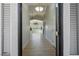 Inviting foyer featuring a long hallway and light hardwood flooring at 11157 Sandy Grove Ave, Las Vegas, NV 89144