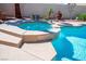 Relaxing hot tub next to the pool in a private backyard oasis at 11157 Sandy Grove Ave, Las Vegas, NV 89144