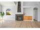Open living area showcasing a modern fireplace, neutral tones, and hardwood flooring at 11157 Sandy Grove Ave, Las Vegas, NV 89144