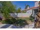 A well-maintained backyard featuring lush green grass and mature trees at 185 Camrose St, Henderson, NV 89074