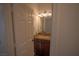 Modern bathroom features a vanity with granite countertop and stylish lighting at 185 Camrose St, Henderson, NV 89074