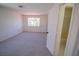 Bright bedroom with plush carpet, neutral walls, and an en-suite bathroom at 185 Camrose St, Henderson, NV 89074