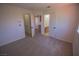 Bedroom with an open bathroom and closet at 185 Camrose St, Henderson, NV 89074