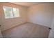 Bedroom with neutral walls and carpet, window views to the outdoors at 185 Camrose St, Henderson, NV 89074