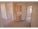 Hallway featuring storage cabinets with drawers, and doorways leading to other rooms at 185 Camrose St, Henderson, NV 89074