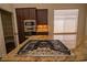 Close-up of kitchen island cooktop with granite countertops and stainless steel appliances at 185 Camrose St, Henderson, NV 89074