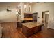 Spacious kitchen with wood floors, granite island and countertops, and stainless steel appliances at 185 Camrose St, Henderson, NV 89074