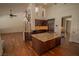 Gourmet kitchen with granite island, custom cabinetry, and stainless steel appliances at 185 Camrose St, Henderson, NV 89074