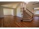 Large living room boasts hardwood floors and a carpeted staircase at 185 Camrose St, Henderson, NV 89074