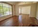 Spacious living room featuring hardwood floors and a large window that provides ample natural light at 185 Camrose St, Henderson, NV 89074