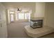 Bright living room features a fireplace and large windows offering natural light at 185 Camrose St, Henderson, NV 89074