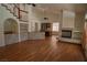 Spacious living room with hardwood floors, fireplace, and open kitchen concept at 185 Camrose St, Henderson, NV 89074