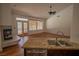 Open living space with hardwood floors, fireplace, and views of the backyard pool at 185 Camrose St, Henderson, NV 89074