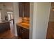 Convenient pantry adjacent to the kitchen featuring ample storage cabinets and granite countertops at 185 Camrose St, Henderson, NV 89074