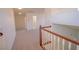 Staircase railing looking over open upstairs hallway with doorways to additional rooms at 185 Camrose St, Henderson, NV 89074