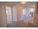 Open upstairs hallway with neutral carpet, and doorways leading to other rooms at 185 Camrose St, Henderson, NV 89074