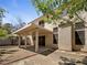 A view of the backyard with patio cover and desert landscaping at 2125 Stone Well Rd, North Las Vegas, NV 89031