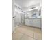 Bathroom featuring a double vanity with a glass-enclosed shower and tile flooring at 2125 Stone Well Rd, North Las Vegas, NV 89031