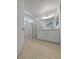 Bathroom featuring a double vanity with a glass-enclosed shower and tile flooring at 2125 Stone Well Rd, North Las Vegas, NV 89031