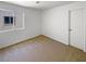This simple bedroom boasts neutral carpet and a bright window, creating a calm, inviting space at 2125 Stone Well Rd, North Las Vegas, NV 89031