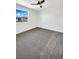 Bright bedroom with neutral carpet and window view at 2125 Stone Well Rd, North Las Vegas, NV 89031