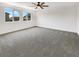 Spacious bedroom with neutral carpeting, bright lighting, and ample space for entertaining and relaxation at 2125 Stone Well Rd, North Las Vegas, NV 89031