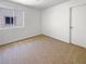 This simple bedroom boasts neutral carpet and a bright window, creating a calm, inviting space at 2125 Stone Well Rd, North Las Vegas, NV 89031