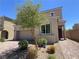 Charming two-story home with desert landscaping and a brick driveway at 2125 Stone Well Rd, North Las Vegas, NV 89031
