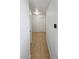 The hallway features neutral carpet, bright lighting and a simple design, creating a welcoming transition at 2125 Stone Well Rd, North Las Vegas, NV 89031