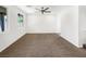Spacious living room with neutral carpeting, bright lighting, and ample space for entertaining and relaxation at 2125 Stone Well Rd, North Las Vegas, NV 89031