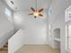 Bright, open living room features soaring ceilings, a modern ceiling fan, and lots of natural light at 2125 Stone Well Rd, North Las Vegas, NV 89031