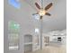 Large living room with tall ceilings, many windows, and views into the kitchen at 2125 Stone Well Rd, North Las Vegas, NV 89031
