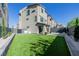Spacious backyard with artificial turf, modern landscaping, and a serene outdoor living space at 2151 Noble Perch St, Las Vegas, NV 89138