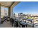 Balcony with stools, a bar, and a grill, perfect for outdoor cooking and dining at 2151 Noble Perch St, Las Vegas, NV 89138