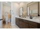Bathroom features a double vanity with modern faucets and hardware at 2151 Noble Perch St, Las Vegas, NV 89138