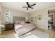 This bedroom is beautifully appointed with a neutral palette, plush rug, and direct access to another sitting area at 2151 Noble Perch St, Las Vegas, NV 89138