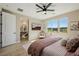 This bedroom is filled with natural light and features an ensuite bathroom and views to the well-kept exterior at 2151 Noble Perch St, Las Vegas, NV 89138
