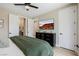 Comfortable bedroom featuring a TV above a dresser and access to an ensuite bathroom at 2151 Noble Perch St, Las Vegas, NV 89138