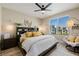 Bright bedroom featuring a large window, ceiling fan, and stylish furniture at 2151 Noble Perch St, Las Vegas, NV 89138