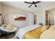 Bedroom with a TV and seating area with view of the ensuite bathroom at 2151 Noble Perch St, Las Vegas, NV 89138