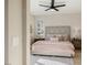 A bright and airy bedroom offers a peaceful retreat with a scenic view and a plush area rug at 2151 Noble Perch St, Las Vegas, NV 89138